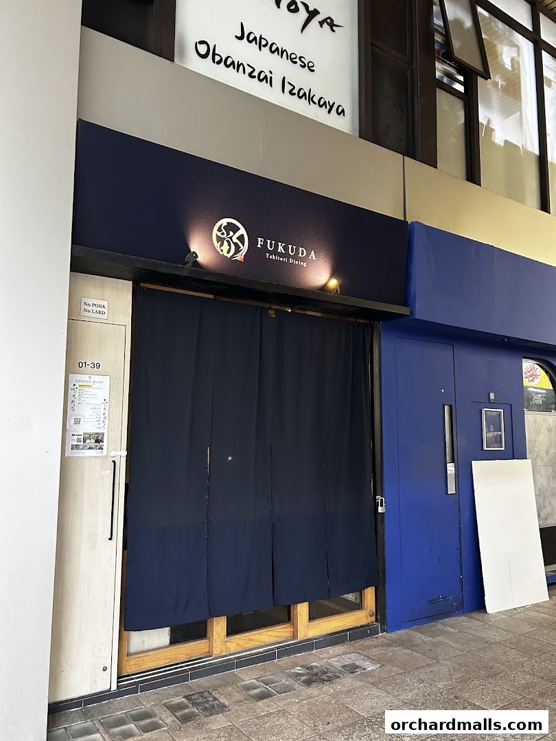 The exterior of FUKUDA Yakitori Dining Singapore with a dark blue curtain covering the entrance.