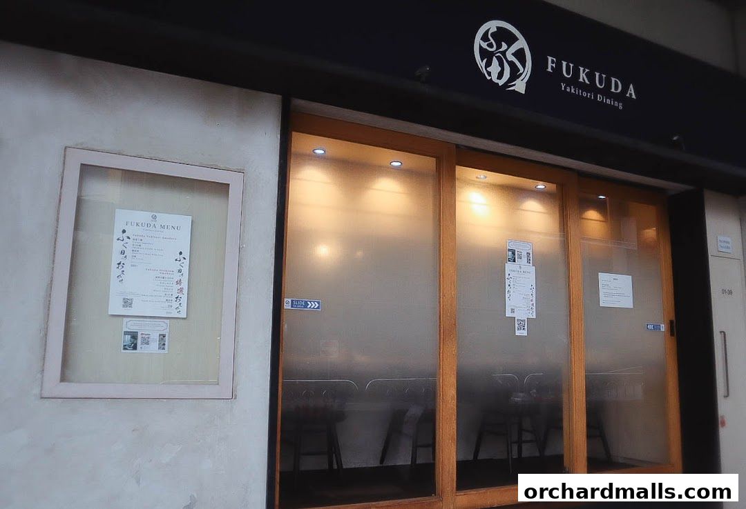 Exterior of FUKUDA Yakitori Dining Singapore with a menu displayed.