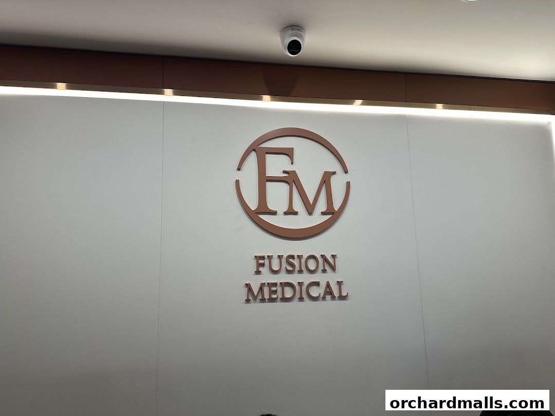 The Fusion Medical logo is displayed prominently on a white wall with modern lighting.