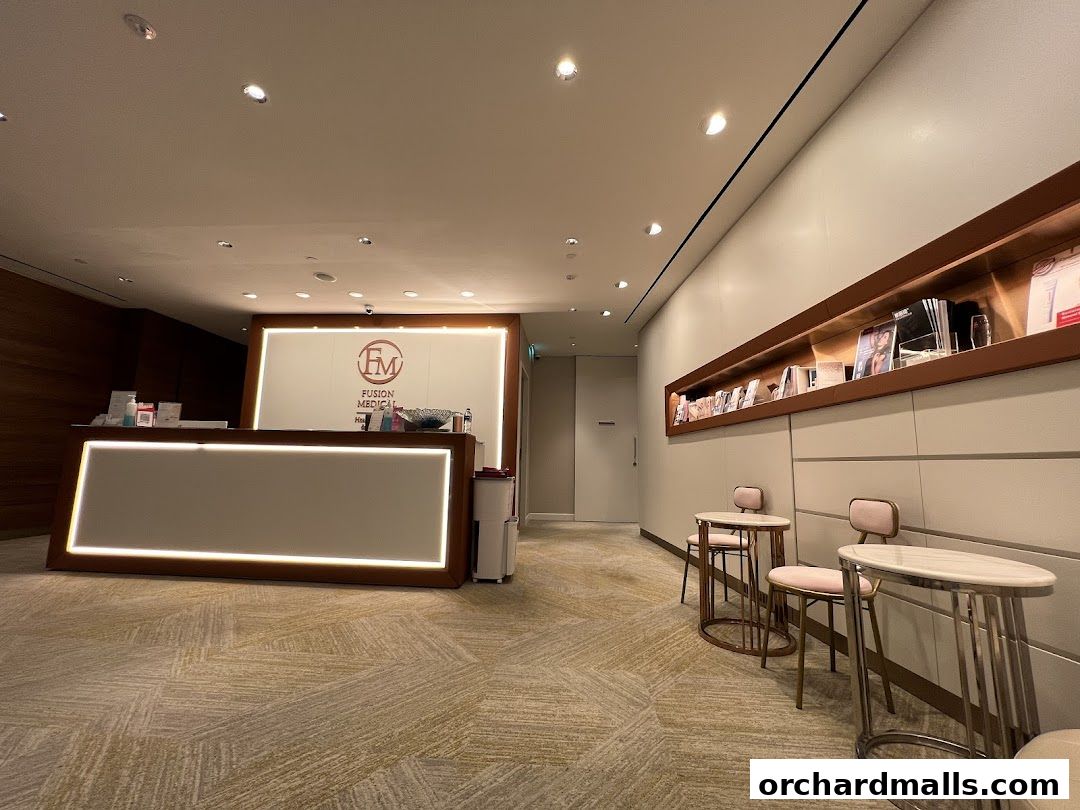 The reception area of Fusion Medical features a modern desk, seating, and a display shelf.
