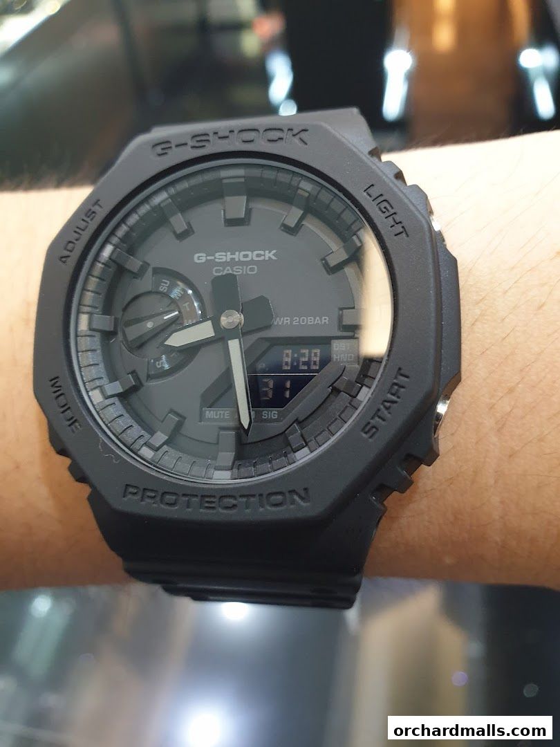 A close-up shot of a black G-Shock Casio watch on a person's wrist.