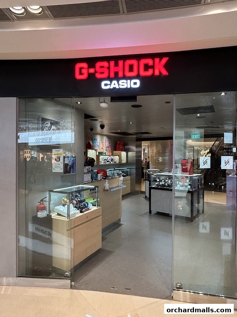 The entrance to a G-SHOCK CASIO store, showcasing display cases with watches.