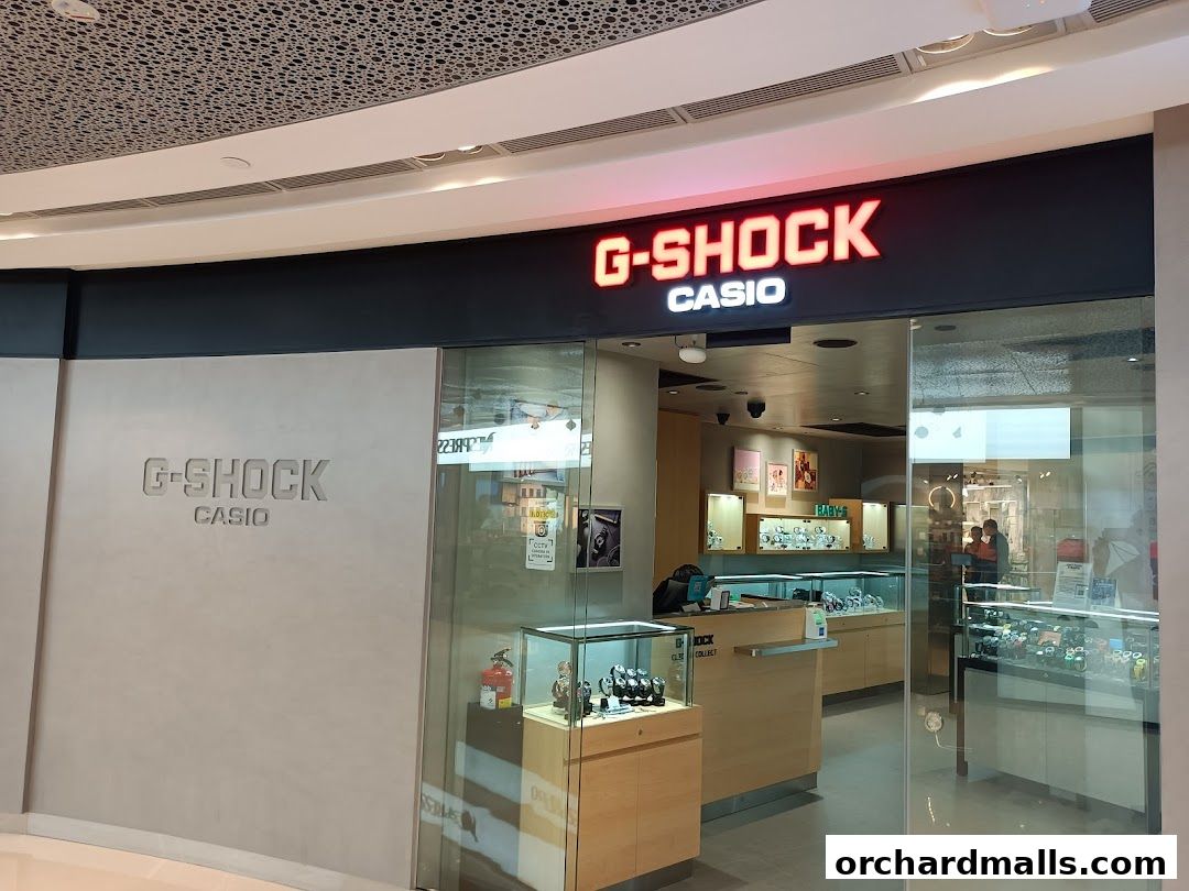 The entrance of a G-SHOCK CASIO store showcasing various watches in display cases.