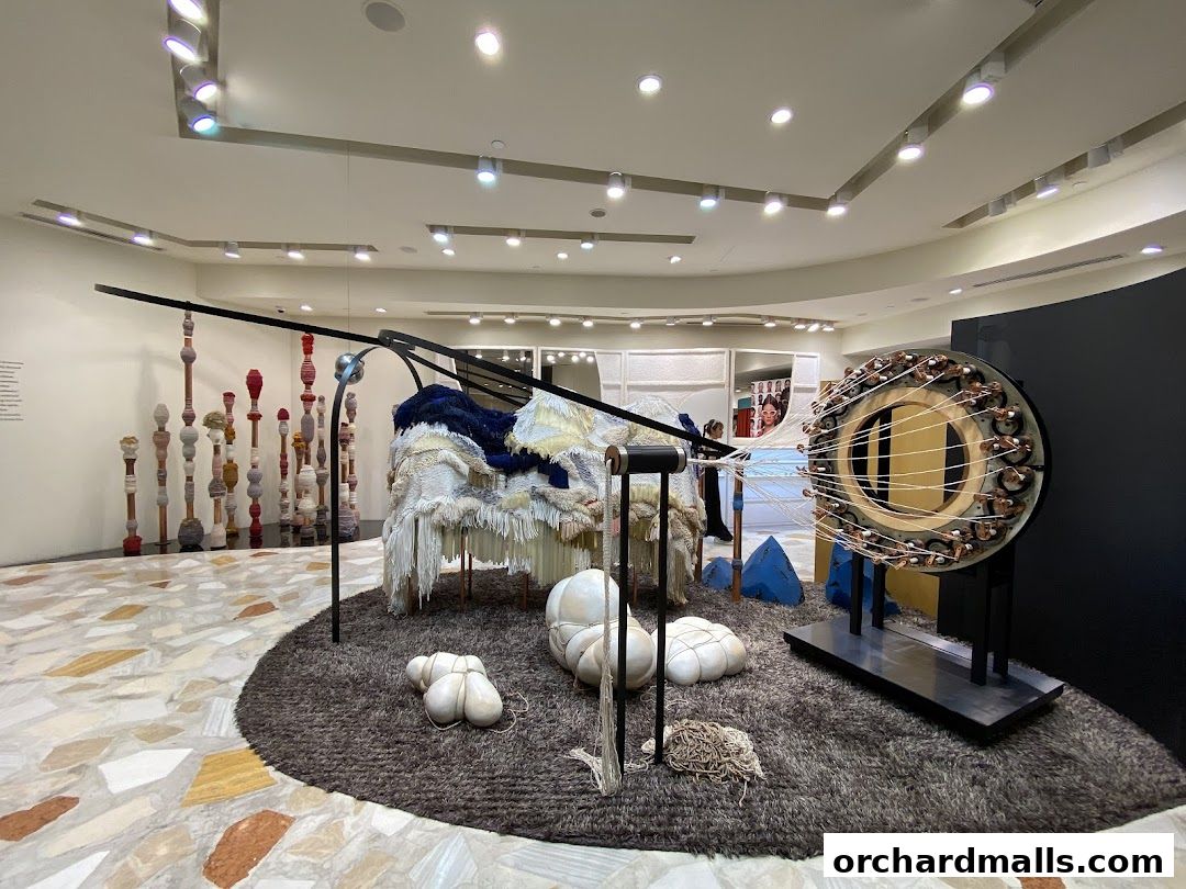 Interior of a modern art installation with sculptures and unique displays.