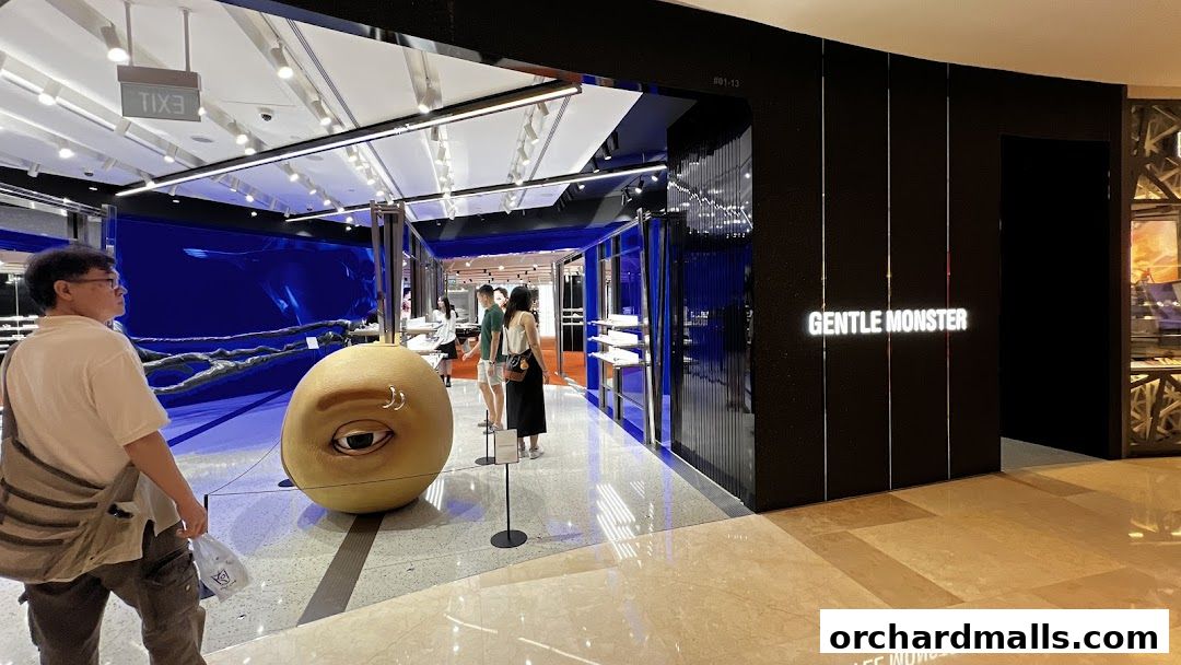 Interior of a stylish eyewear store with artistic displays and customers browsing.