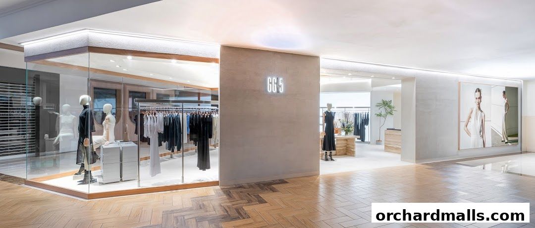 Modern fashion boutique GG5 Takashimaya S C with mannequins and clothing displays.