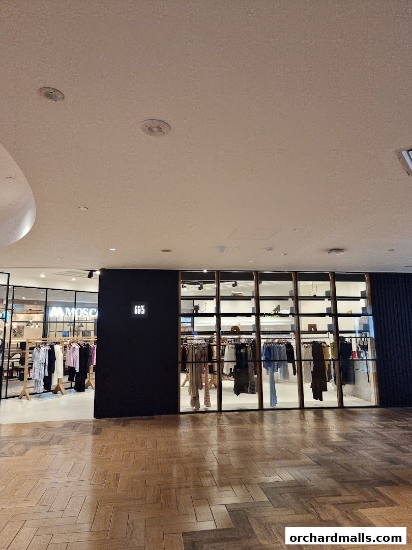 The storefront of GG5 Takashimaya S C, showcasing stylish apparel on display.