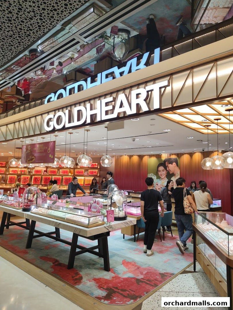 Interior of a Goldheart Jewelry store with displays of jewelry and customers browsing.