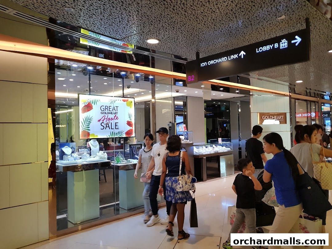 Goldheart Jewelry store with a 'Great Haute Sale' display and shoppers browsing.