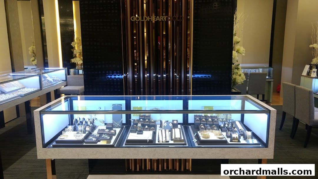 Interior view of a Goldheart Jewelry store with display cases filled with jewelry.