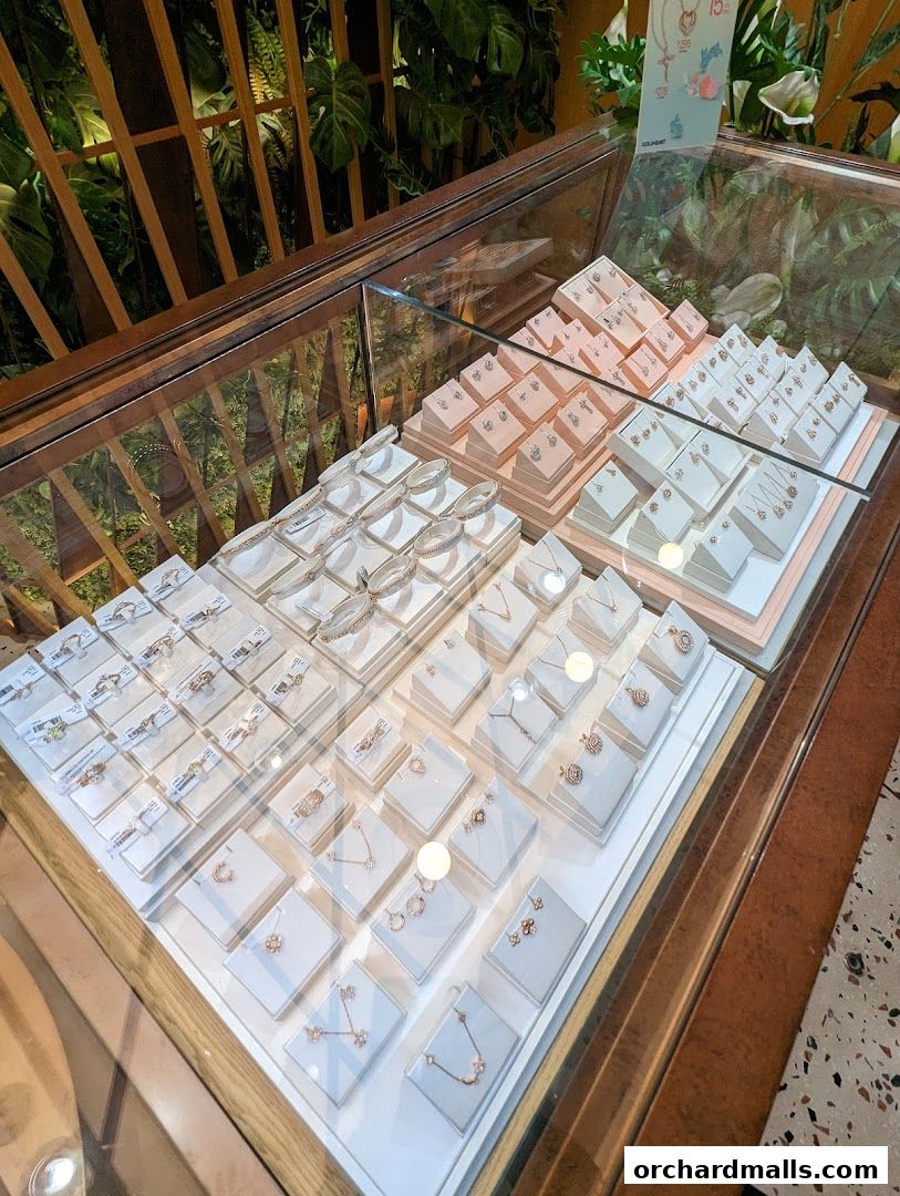 A display case filled with various gold and diamond jewelry, including necklaces, earrings, and bracelets.