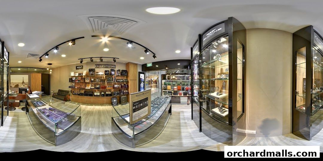 Interior view of Goodmen Luxury watch store showcasing display cases and watches.