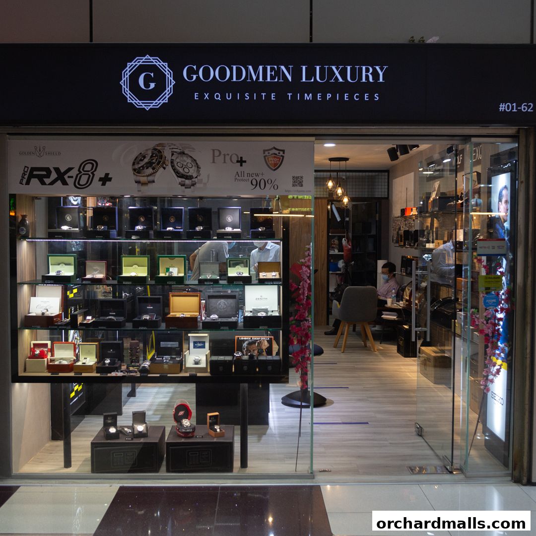 Goodmen Luxury shop front displaying exquisite timepieces in illuminated display cases.