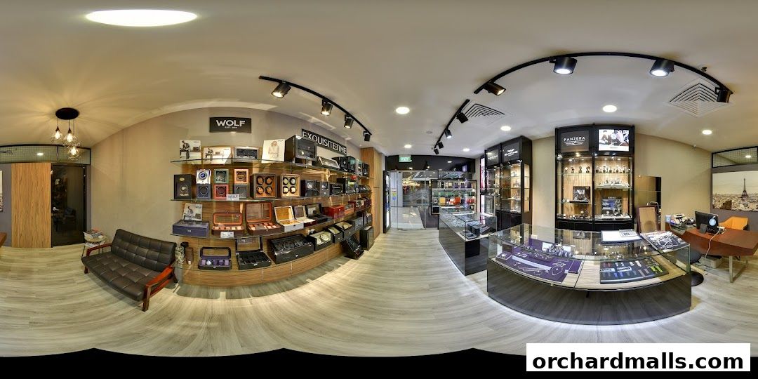 Interior view of a luxury watch and accessory store with display cases and shelves.