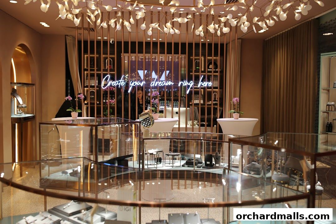 Interior of a jewelry store with display cases and a neon sign.
