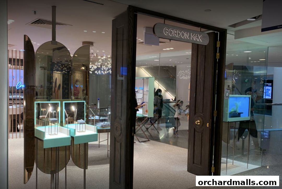 The entrance of Gordon Max, a jewelry store, with display cases and elegant decor.