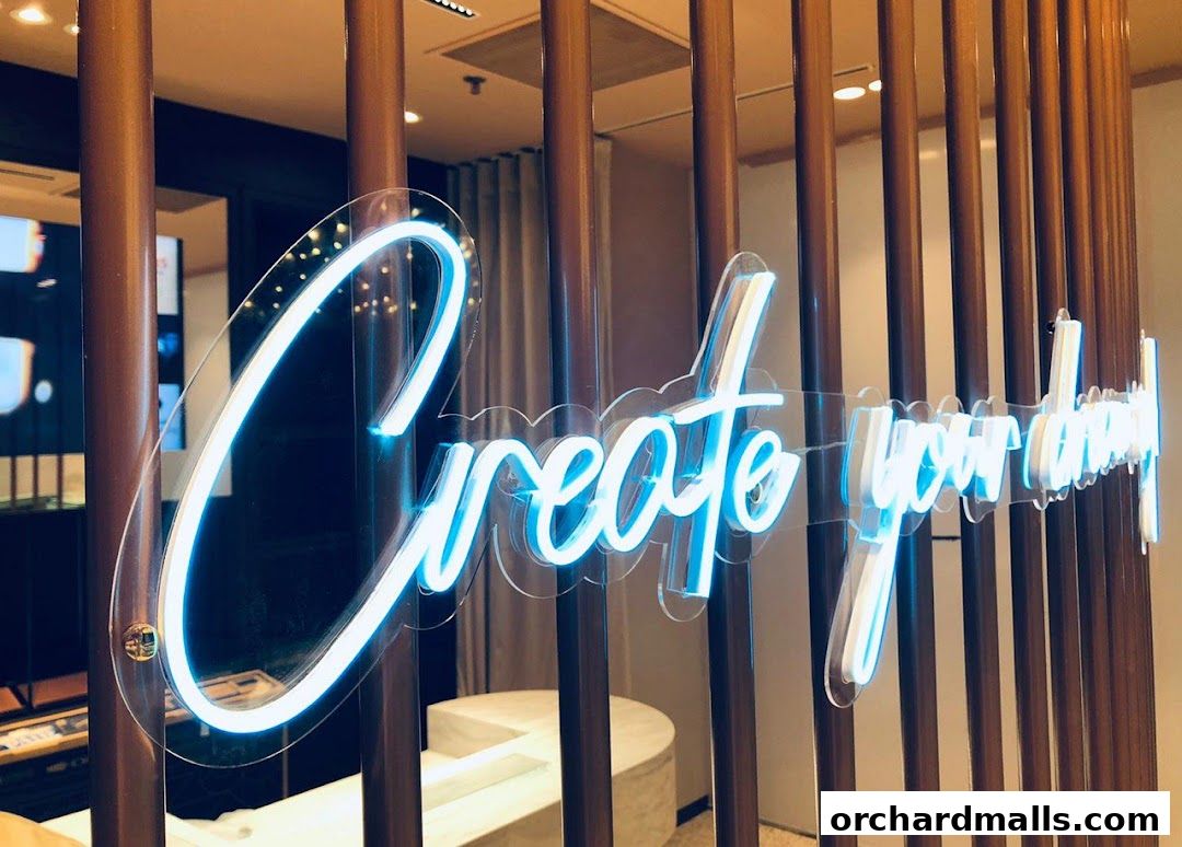 A neon sign that says 'Create your dream' in blue light.