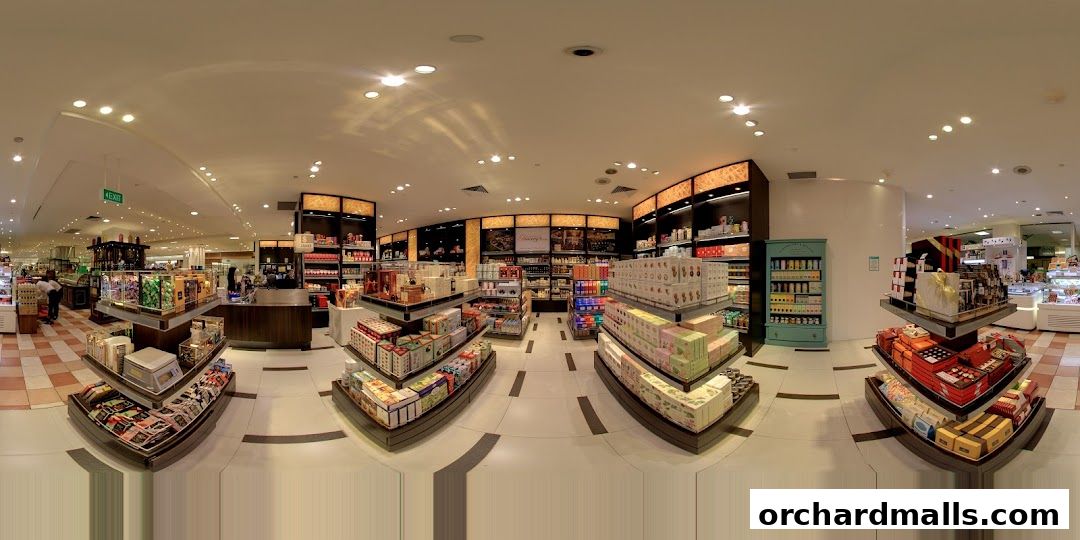 Interior view of a gourmet grocery store with shelves stocked with various food items and gift boxes.
