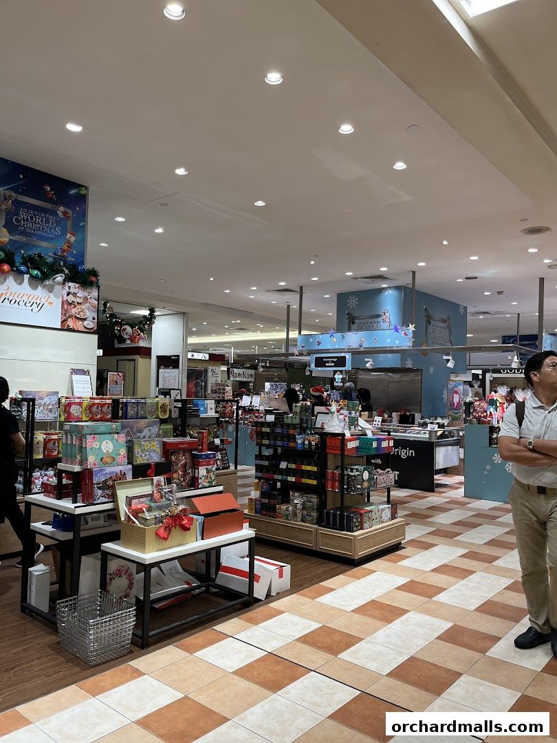 Interior view of Gourmet Grocery by OurChoice, showcasing festive gift sets and products.