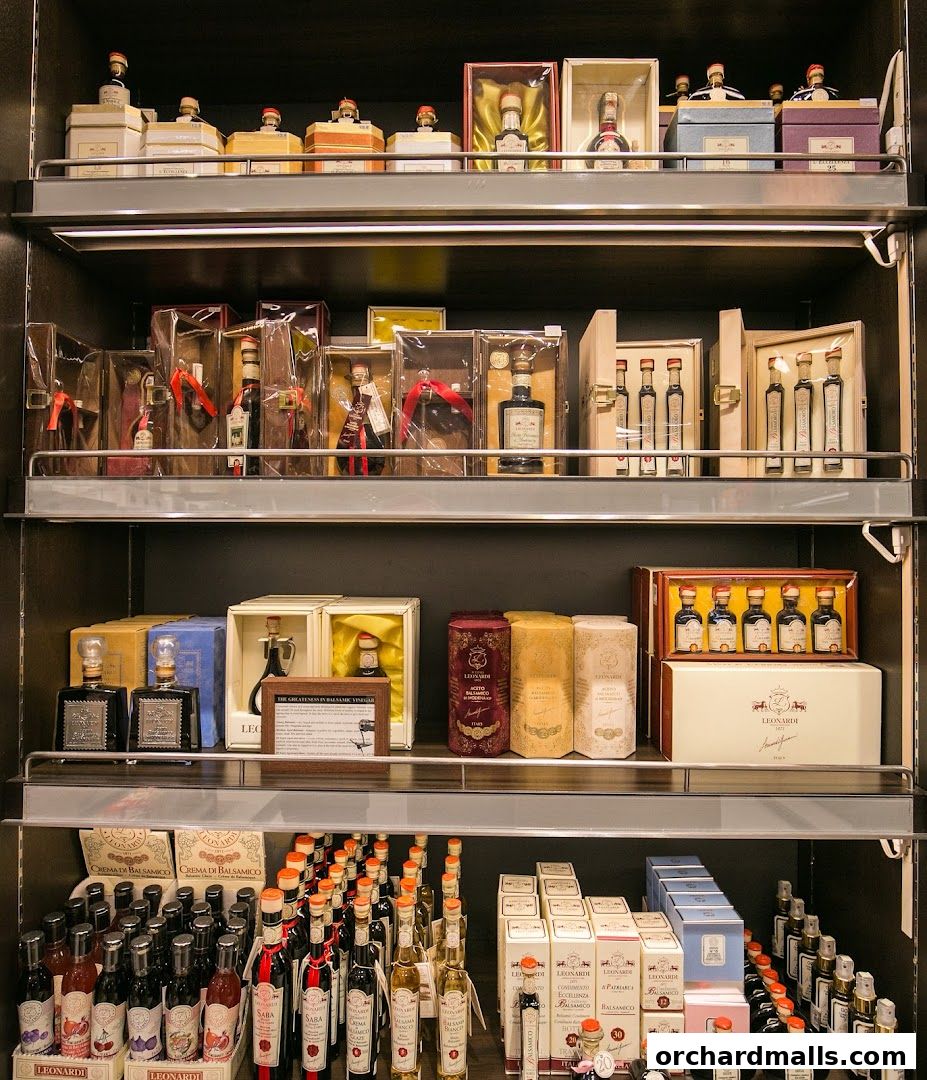 Shelves stocked with various bottles and gift boxes of balsamic vinegar and related products.