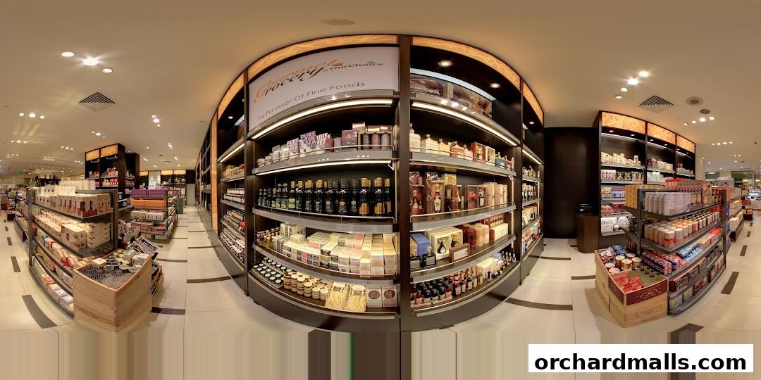 Interior view of a gourmet grocery store with shelves stocked with fine foods and beverages.