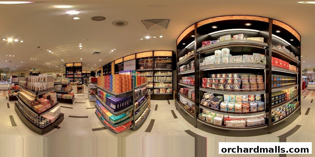 Interior view of a gourmet grocery store with shelves stocked with various food items and gift boxes.