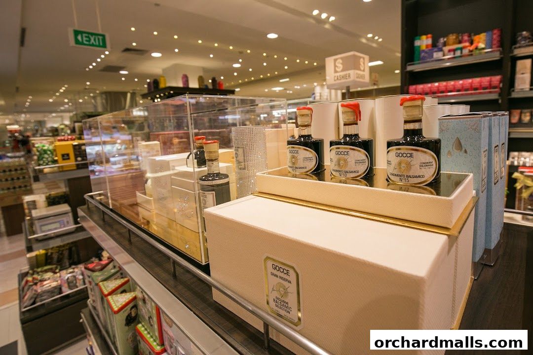 Display of gourmet balsamic vinegar bottles and gift boxes in a retail store.
