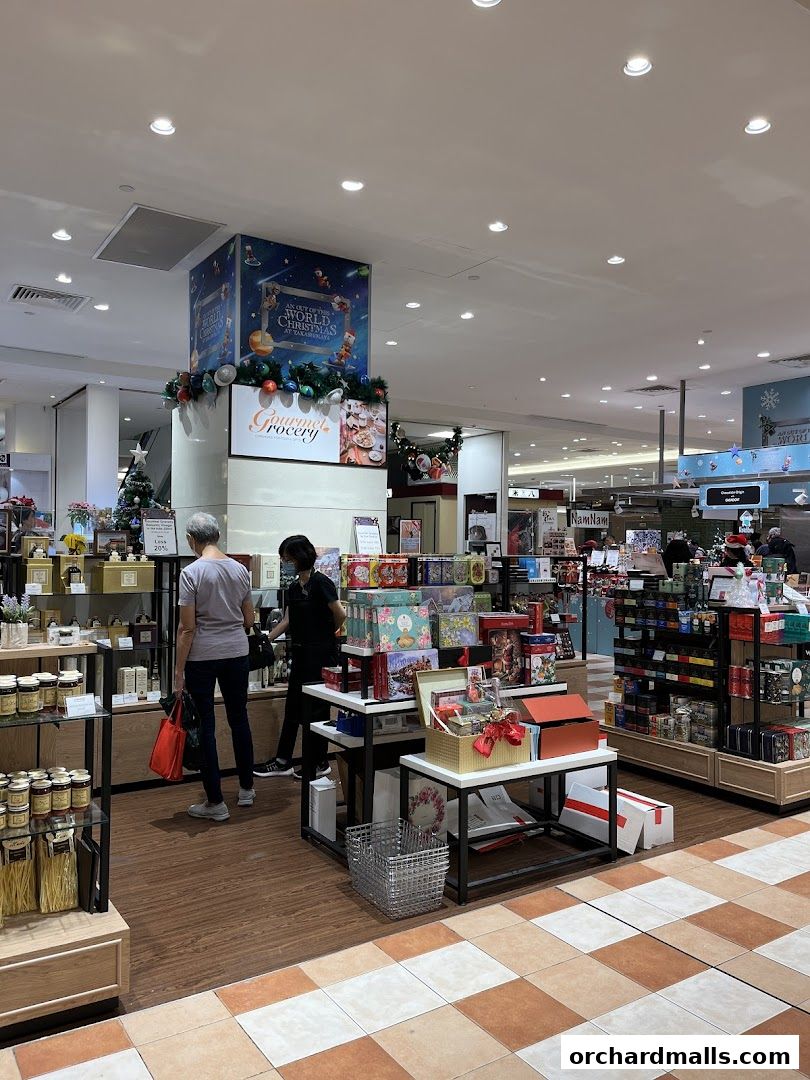 Gourmet Grocery store interior with Christmas decorations and gift displays.