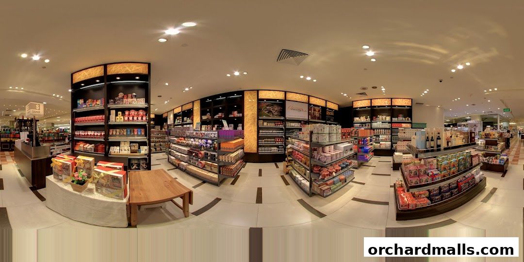 Interior view of Gourmet Grocery by OurChoice, showcasing shelves stocked with various food items and gift sets.