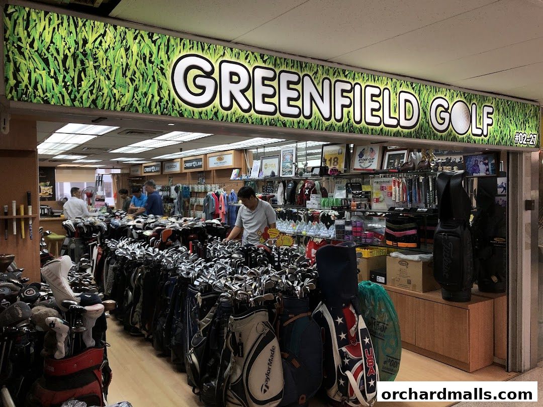 Interior view of Greenfield Golf shop with numerous golf clubs and bags on display.