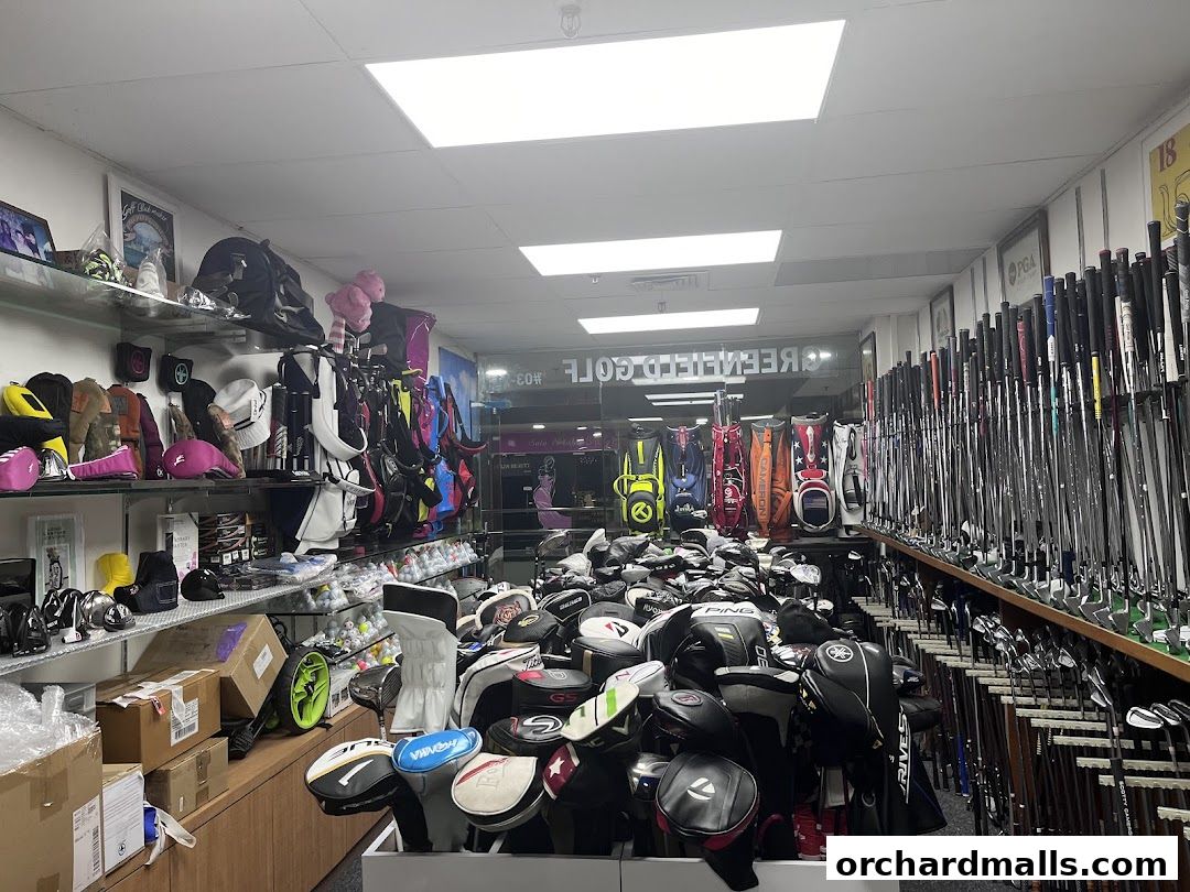 Interior of a golf shop filled with golf clubs, bags, and accessories.