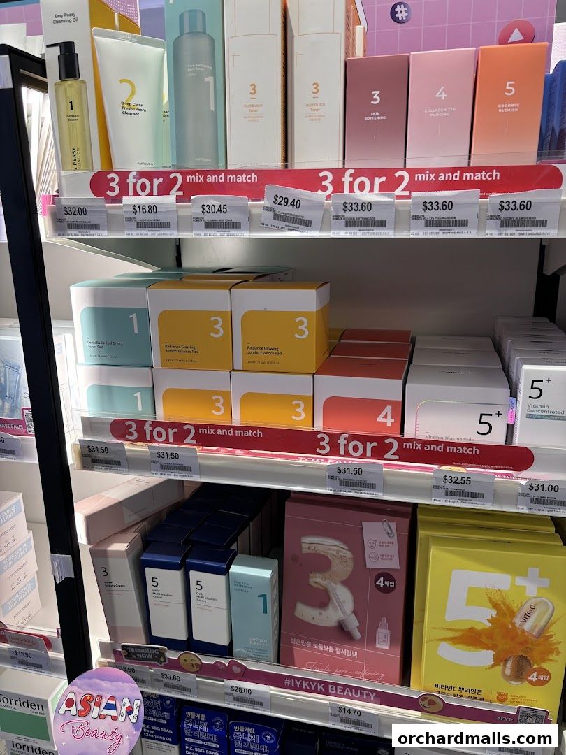 Shelves display various skincare products with '3 for 2' mix and match offers.