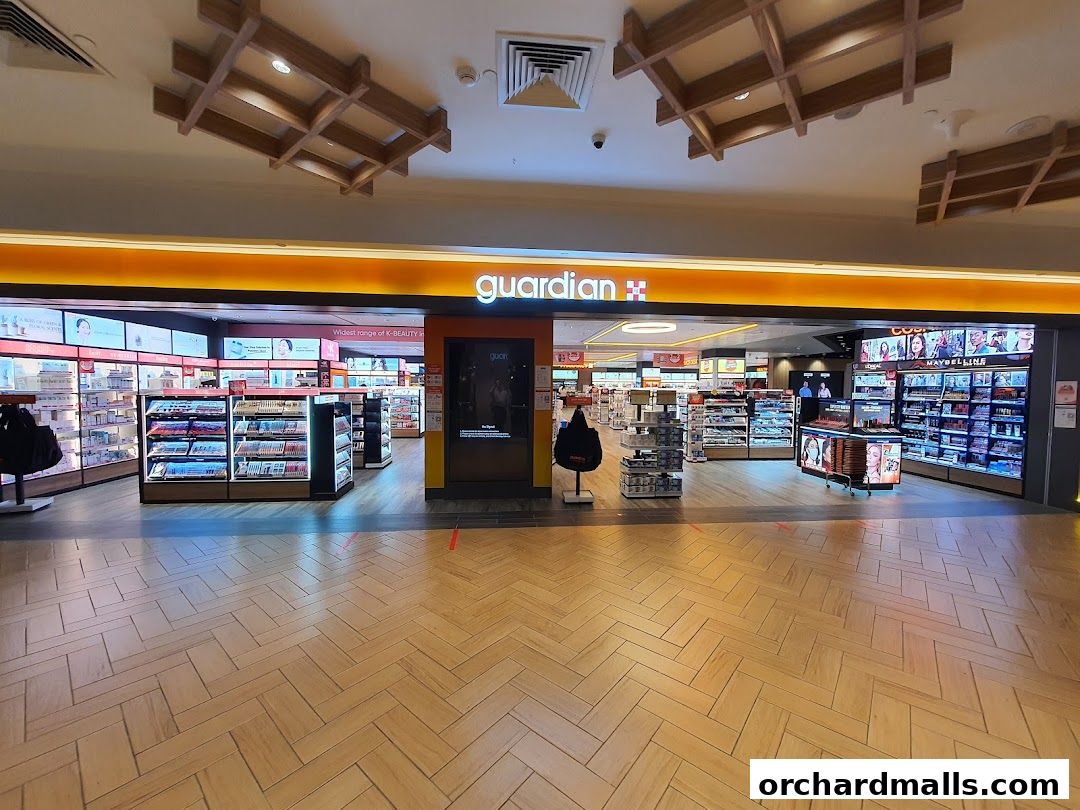 The entrance to Guardian Health & Beauty Pharmacy, showcasing a wide selection of beauty products.