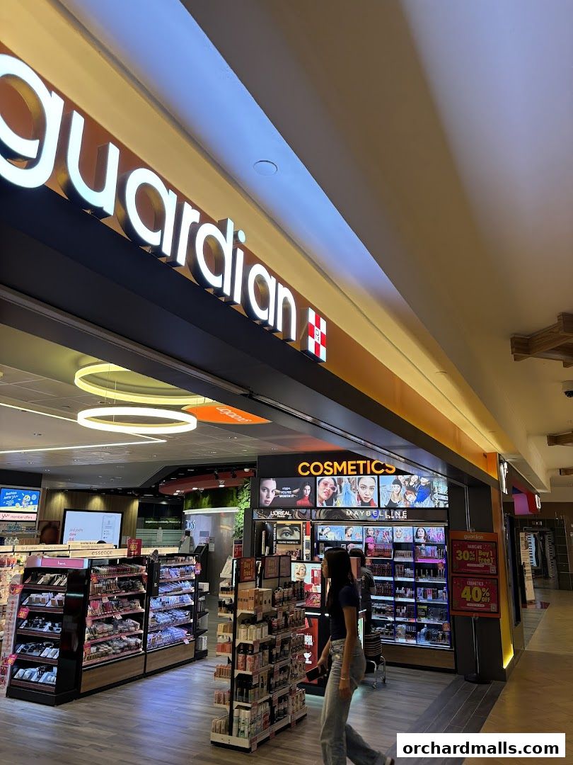 Guardian Health & Beauty Pharmacy store interior with cosmetics and health products on display.