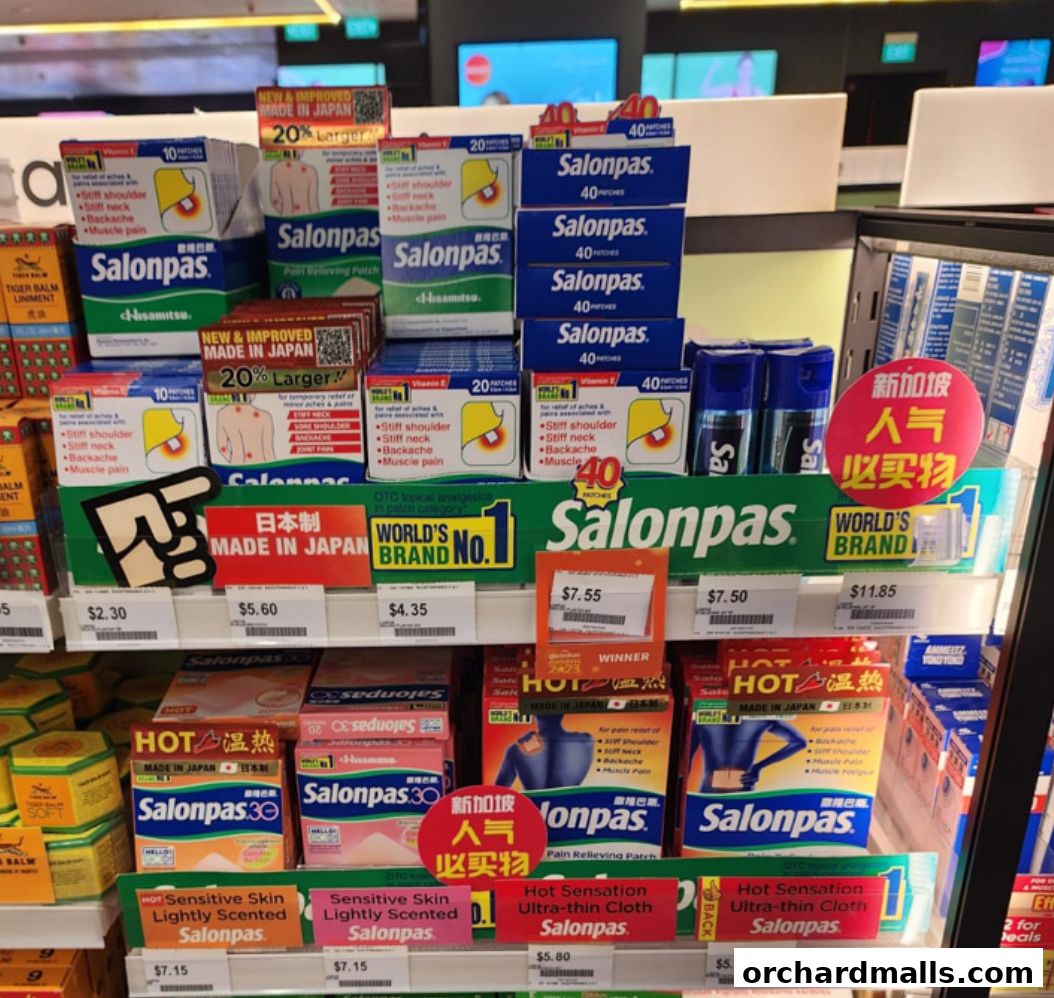 A display of Salonpas pain relief patches and other health products in a retail store.