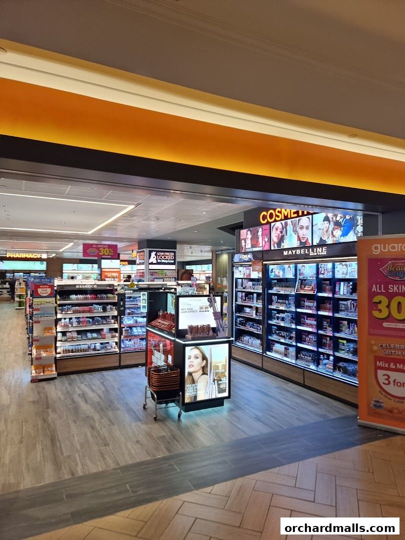 Interior view of a Guardian Health & Beauty store with cosmetics and pharmacy sections.