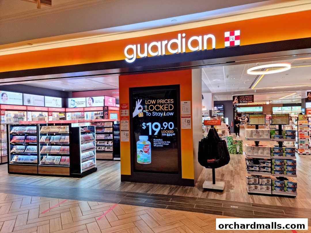 Guardian Health & Beauty Pharmacy store entrance with promotional display and product shelves.