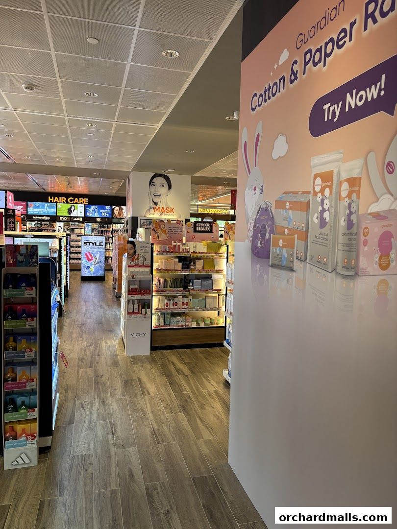 Interior view of a Guardian Health & Beauty store with shelves of cosmetics and personal care products.
