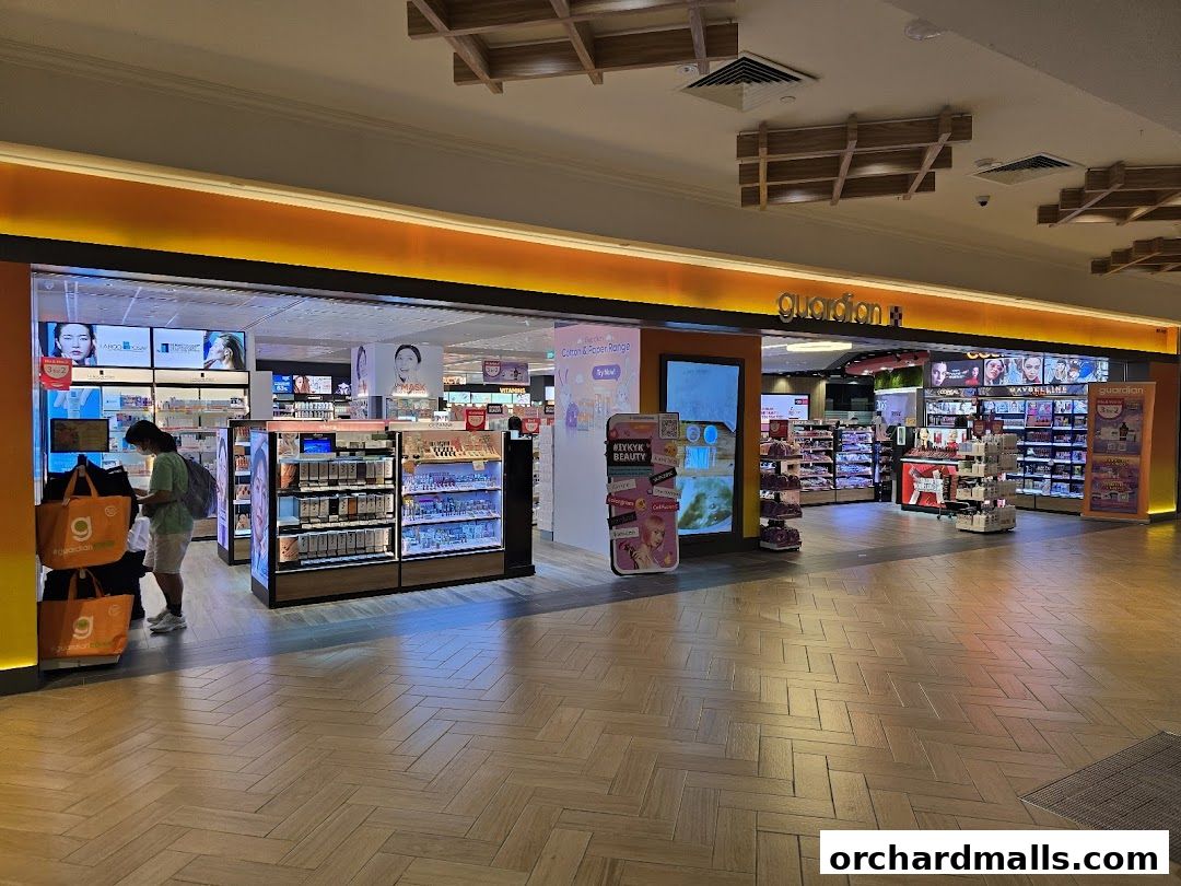 The entrance of a Guardian Health & Beauty store with products displayed.