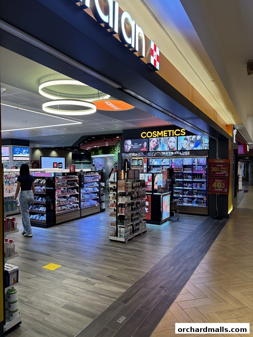 Interior view of a Guardian Health & Beauty store with cosmetics and health products on display.