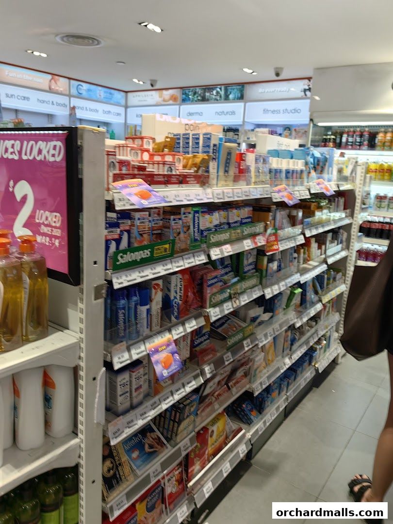 Aisle of health and beauty products in a retail store, featuring various brands and promotions.