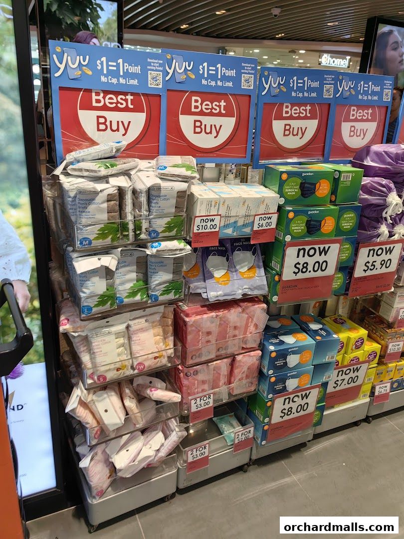 A display of health and beauty products, including face masks and sanitary items, with promotional pricing.