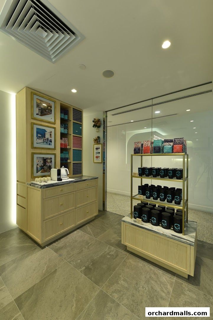 Interior view of Gumption Coffee shop with coffee products displayed on shelves.