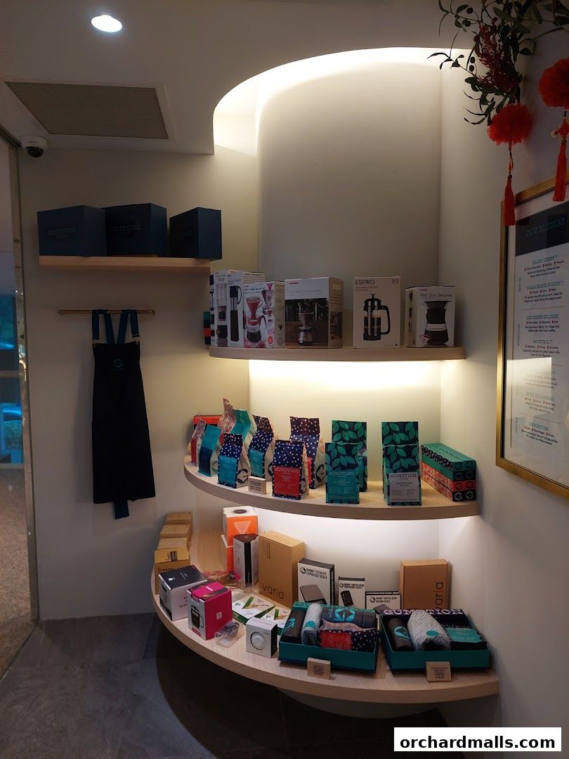 Gumption Coffee shop interior displaying coffee beans, brewing equipment, and merchandise.