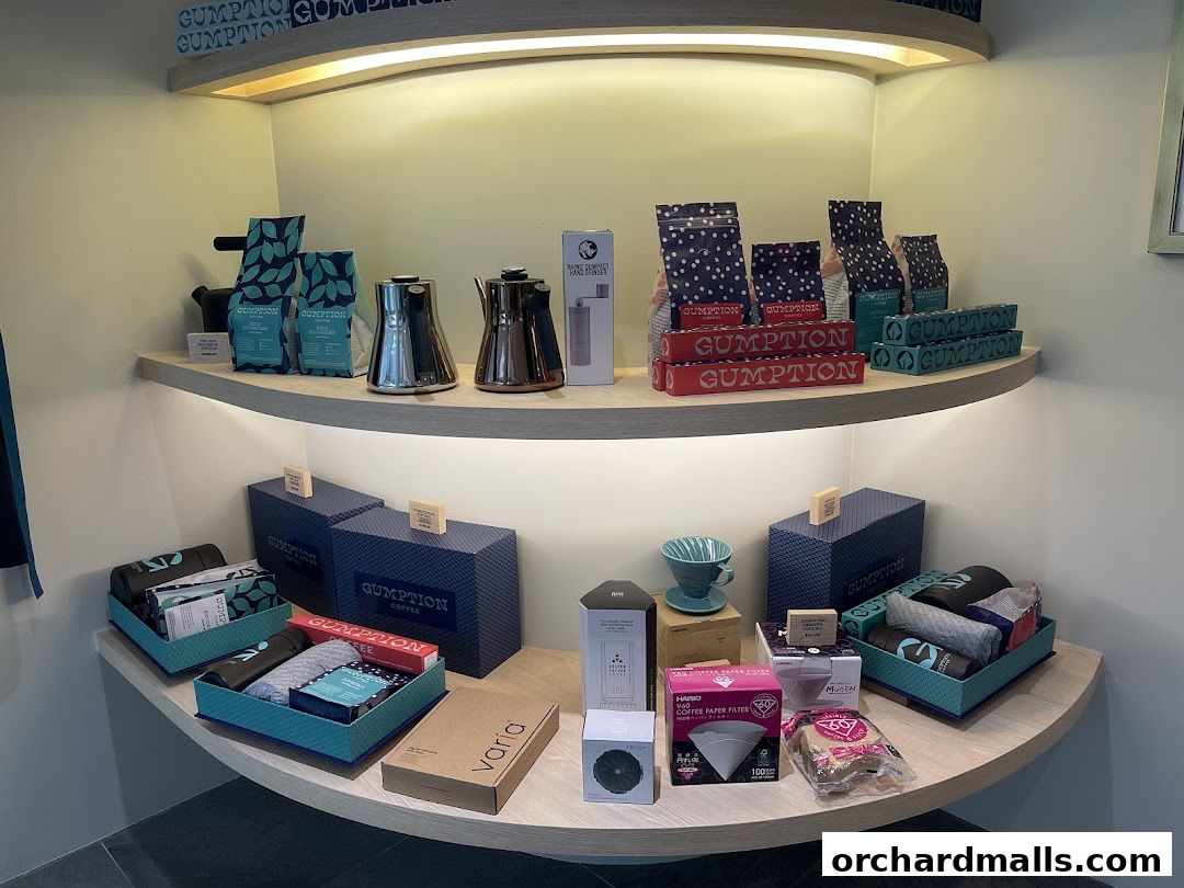 Gumption Coffee shop displays bags of coffee, kettles, and brewing accessories.