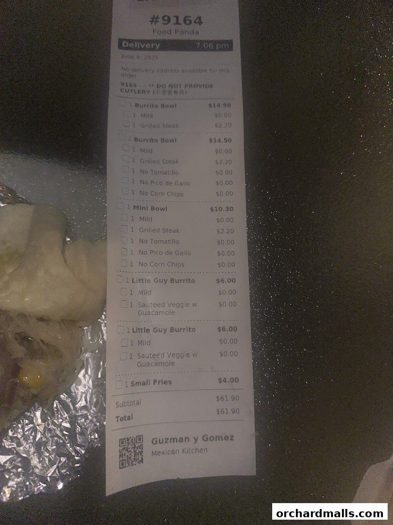 A receipt from Guzman y Gomez showing a list of Mexican food items and their prices.