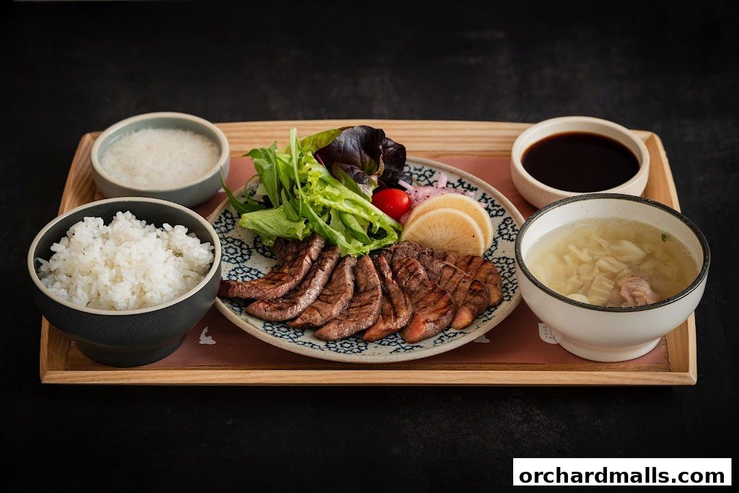 A delicious grilled beef tongue set meal with rice, soup, and salad.