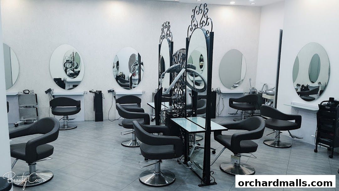 Interior view of a modern hair salon with multiple styling stations and mirrors.