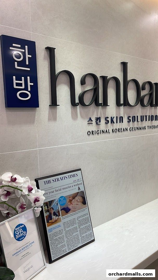 Hanbang Skin Solutions shop sign with awards and newspaper clipping.