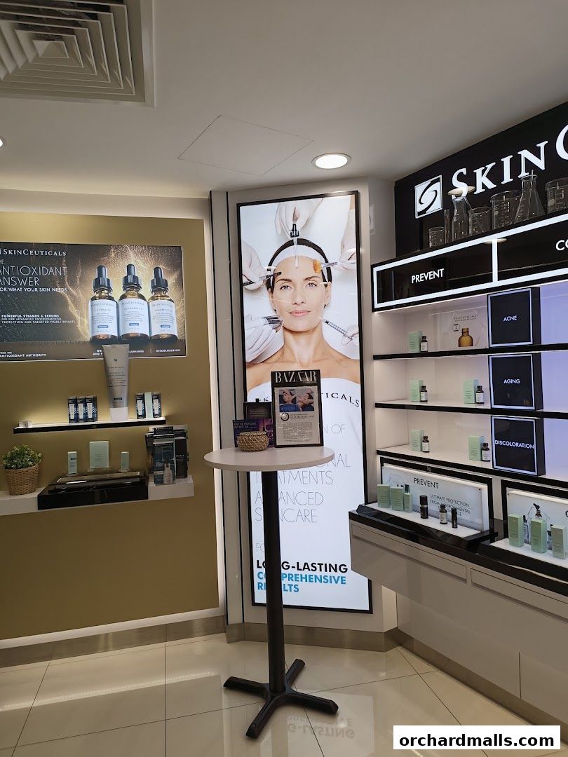 Interior view of a skincare shop with product displays and promotional posters.